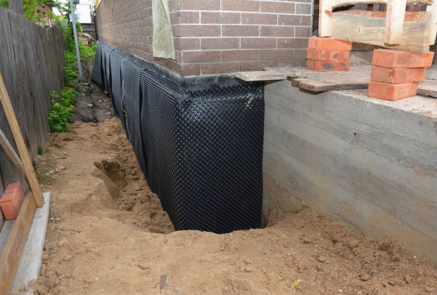 SJ Waterproofing Pros technician performing targeted Emergency Waterproofing assessment in Trafford, PA